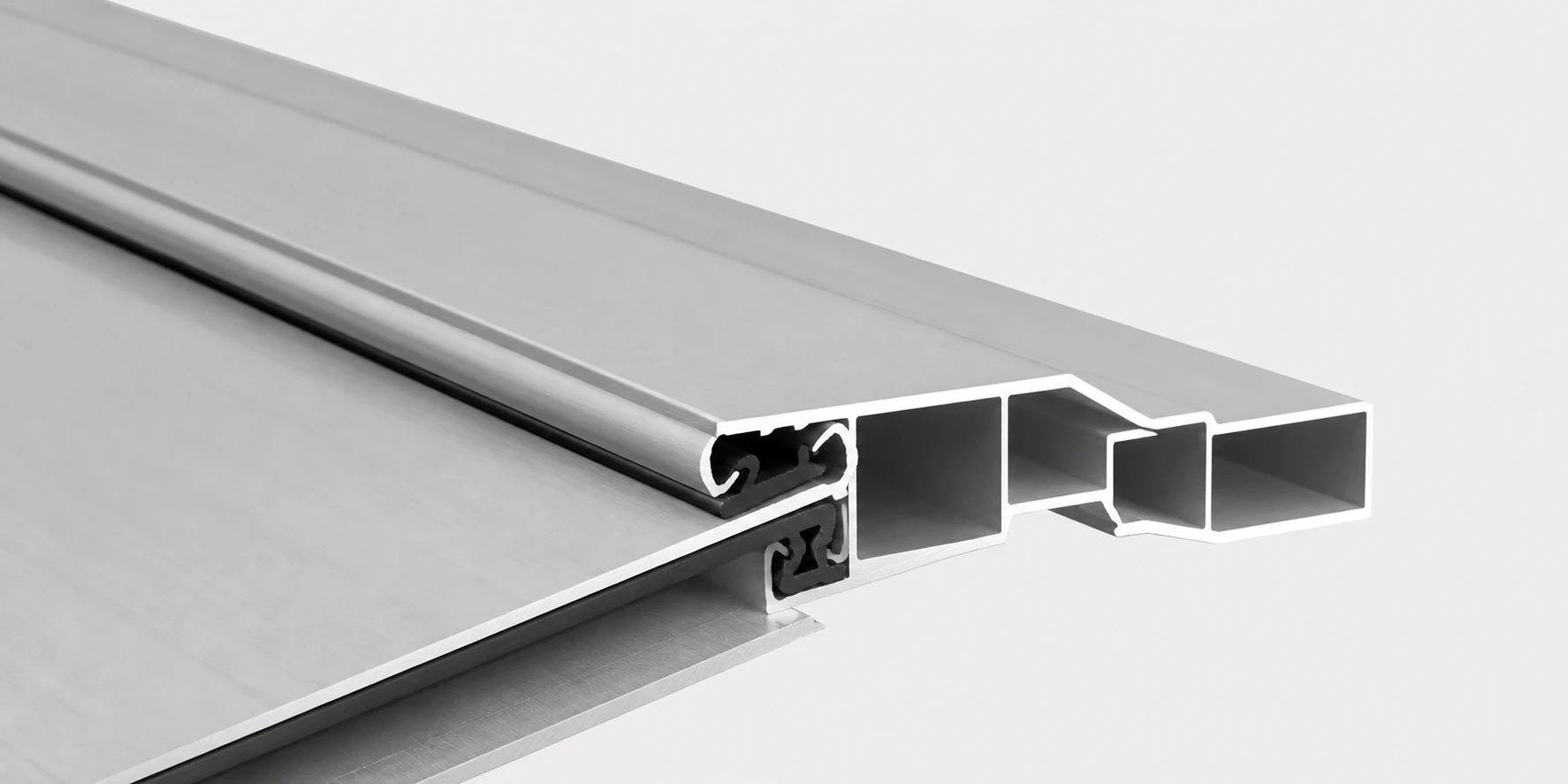 Extruded aluminum louver profile showing the hollow section and overlap edge