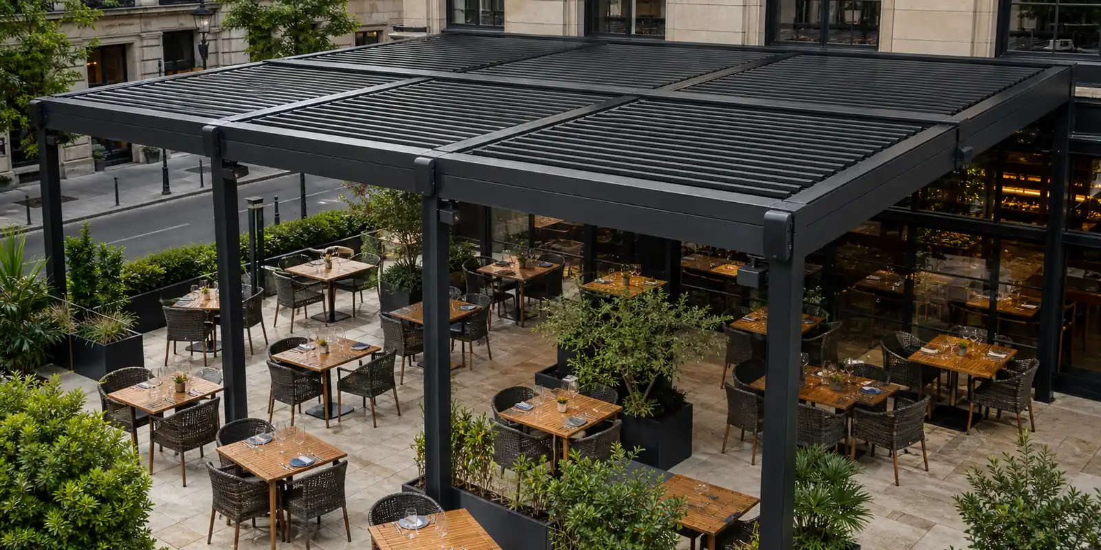 Motorized louvered pergola covering a commercial restaurant terrace with dining tables