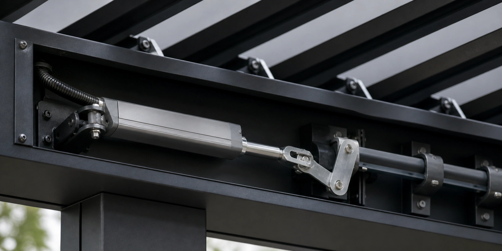 Linear actuator mounted inside an adjustable louvered pergola roof assembly